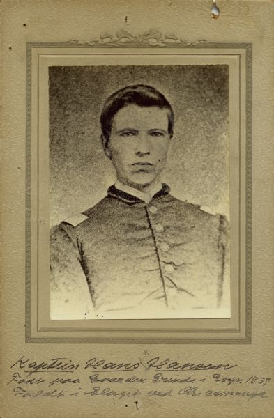 Quarter-length studio portrait of Hans Hanson, a captain in Company C, 15th Wisconsin Infantry, in uniform. The following information was obtained from the Regimental and Descriptive Rolls, Volume 20: He resided in Norway, Wisconsin. On November 22, 1861, he was commissioned as first lieutenant by the governor of Wisconsin and was mustered into service in Madison, Wisconsin at age 24. He was promoted to the rank of captain on June 23, 1862, at Murfreesboro, Tennessee. He died on October 12, 1863, in Atlanta, Georgia, from wounds he received at the Battle of Chickamauga, Georgia. He was initially buried at Atlanta, Georgia, but was moved to the National Cemetery at Marietta, Georgia.  Buried at: Section A, Site 1070, Grave G.