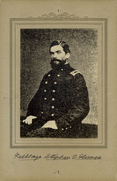 Waist-up seated studio portrait of Stephen O. Himoe, a surgeon in the 15th Wisconsin Infantry, in uniform. The following information was obtained from the Regimental and Descriptive Rolls, Volume 20: He resided in Laurence, Kansas. On November 11, 1861, he was commissioned as a surgeon by the governor of Wisconsin and was mustered into service in Madison, Wisconsin at age 29. From February to May 1863, he was detached by order of General William Rosecrans to serve at the hospital in Murfreesboro, Tennessee. Starting on October 6, 1863, by order of Doctor Glover Perin, the medical director for the Department of the Cumberland, he was placed in charge of the hospital for the 1st Division, 20th Army Group at Chattanooga, Tennessee. Stephen O. Himoe resigned his commission on November 13, 1863, due to disability.