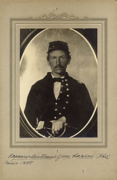 Waist-up studio portrait of James Larson, a first lieutenant in Company C, 15th Wisconsin Infantry in uniform. The following information was obtained from the Regimental and Descriptive Rolls, Volume 20: He resided in Perry, Wisconsin. On January 1, 1862, he was enlisted as a private and mustered into service on February 13, 1862, in Madison, Wisconsin at age 27. He was named commissary sergeant on February 28, 1862. He was commissioned as a second lieutenant on July 9, 1862. From August to December 1862, he was the acting brigade commissary. On April 11, 1863, he became acting regimental quarter master. He was in command of a supply train of the 1st Division in September 1863. Because of an illness, he was left behind in Chattanooga, Tennessee. In February 1864, he was the temporary commander of Company A, 15th Wisconsin Infantry. The following month he was made acting post commissary at Strawberry, Plaines, Tennessee. In April 1864, he was appointed brigade ambulance director. He was promoted to first lieutenant on October 19, 1864. He was mustered out of service with C Company on December 31, 1864, at Chattanooga, Tennessee.