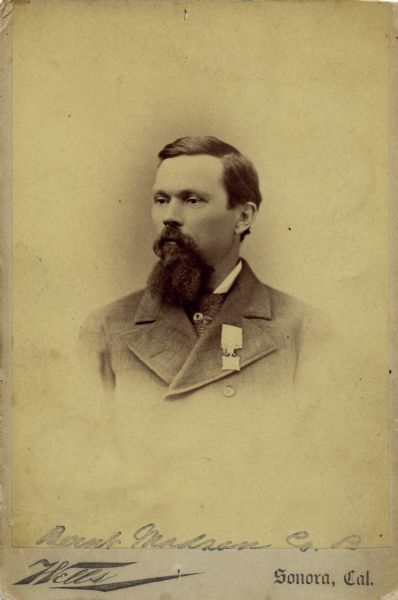 A vignetted, quarter-length cabinet card portrait of Bernt J. Madsen a sergeant in Company B, 15th Wisconsin Infantry. The following information was obtained from the Regimental and Descriptive Rolls, Volume 20: He resided in Cambridge, Wisconsin. On October 1, 1861, he enlisted and was mustered into service in Madison, Wisconsin on January 18, 1861, at the age of 22. He was taken prisoner during the battle at Chickamauga, Georgia. As a prisoner of war, he was held at Richmond, Virginia. He did not muster out of service with the company, but instead was mustered out of service on January 27, 1865, in Madison, Wisconsin.