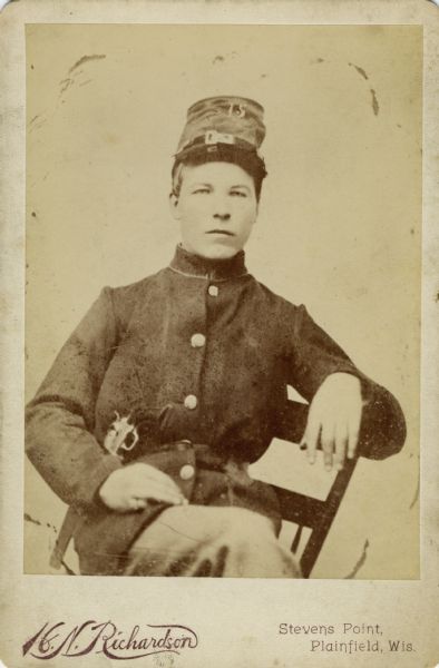 Seated, three-quarter length cabinet card portrait of Martin Norde, a first sergeant in Company I, 15th Wisconsin Infantry in uniform. The following information was obtained from the Regimental and Descriptive Rolls, Volume 20: He resided in Scandinavia, Wisconsin. On November 20, 1861, he enlisted in Scandinavia, Wisconsin and on December 20, 1861, he was mustered into service in Madison, Wisconsin at the age of 19. From October 1863 to May 1864 he was absent recruiting. On January 1, 1865, he was appointed first sergeant. He was mustered out of service on February 10, 1865, at Chattanooga, Tennessee.