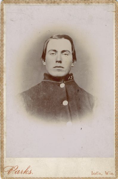 Vignetted head and shoulders cabinet card portrait of Ole Peterson, a private in Company I, 15th Wisconsin Infantry in uniform. The following information was obtained from the Regimental and Descriptive Rolls, Volume 20: He resided in Scandinavia, Wisconsin. On November 4, 1861, he enlisted in St. Laurence, Wisconsin and on December 20, 1861, he was mustered into service in Madison, Wisconsin at the age of 18. He was listed as missing in action during the battle at New Hope Church, Georgia. He was captured near Dallas, Georgia. On September 9, 1864, he died of scarbutis at the prisoner of war camp near Andersonville, Georgia. He was buried at the Andersonville National Cemetery, grave: 9461.