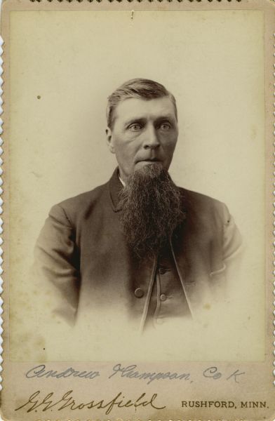 Quarter-length vignetted cabinet card portrait of Andrew Thompson [as written on backing of photograph; also written as Andreas Thompson Descriptive Rolls, Volume 20, published rosters: Wisconsin Volunteers: War of the Rebellion (1914) and Rosters of Wisconsin Volunteers, Volume 1 (1886)], a private in Company K, 15th Wisconsin Infantry. The following information was obtained from the Regimental and Descriptive Rolls, Volume 20: He resided in Fillmore, Minnesota. On February 11, 1863, he enlisted in Fillmore, Minnesota and on February 11, 1862, he was mustered into service in Madison, Wisconsin at the age of 24. He was listed as absent-sick in a general hospital in Farmington, Mississippi from July 21, 1863, to February 3, 1863. On February 11, 1863 until he was discharged on April 22, 1863, for disability he was in a hospital in Nashville, Tennessee.