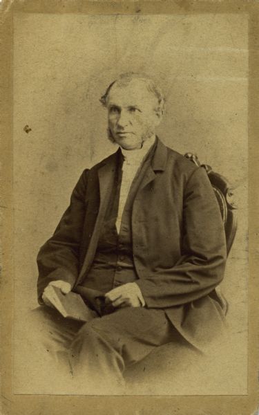 Seated carte-de-visite vignetted portrait of Pastor C.B. Willerup. In 1851, he helped establish the first Norwegian – Danish Methodist church in Cambridge, Wisconsin.