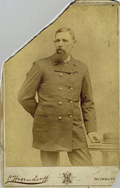 Three-quarter length cabinet card portrait of Captain N.A. Peterson, a native of Milwaukee, Wisconsin, who was master and part owner of the schooner “Selt” in 1873. He also sailed the schooners “City of Toledo” and “Alaska,” and the scow “John F. Prince. In September 1875, he and others rescued a crew of nine from the “Tanner".