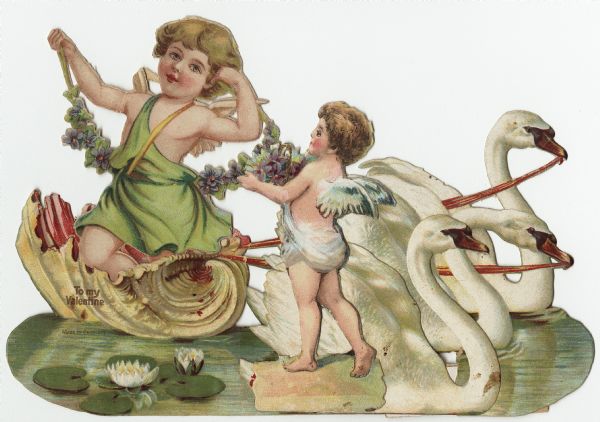 Valentine's Day card made of four pieces. The main piece is of a large shell boat pulled by two swans on a pond filled with water lilies. A cutout of a large cherub is inserted into the shell. On the front is a cutout of a swan with another cutout of a smaller cherub glued to it. Both cherubs are holding flowers. The swans are hinged with paper so they create a three dimensional piece that can stand up. The text "To My Valentine" is printed on the shell. Chromolithograph, embossed, die cut and printed in Germany.