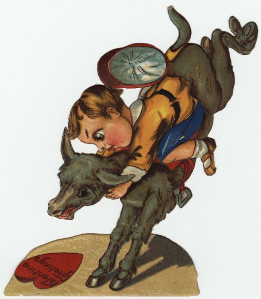 Valentine's Day card featuring a boy riding a bucking donkey. His cap is flying off of his head. A heart is lying on the ground with the text: "Valentine Greetings" on it. There is a paper stand on the back that enables the valentine to stand vertically. Chromolithograph, embossed and die cut.