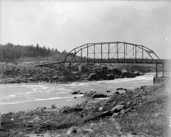 Footbridge spanning the Chippewa River near Brunet Falls (now Cornell Falls)