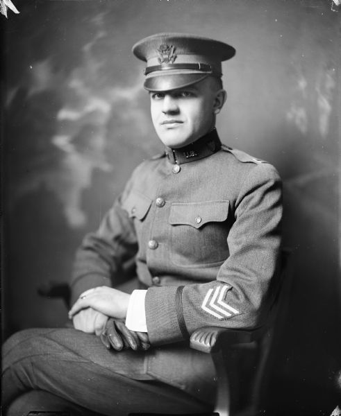 Studio portrait of Capt. R.N. Conners [or "Connors"], seated and wearing a uniform.