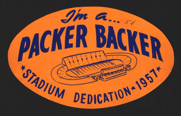 A bright orange and blue sticker advertising the dedication of the new City Stadium (that would eventually become Lambeau Field). Text reads "I'm a Packer Backer" "and Stadium Dedication 1957."