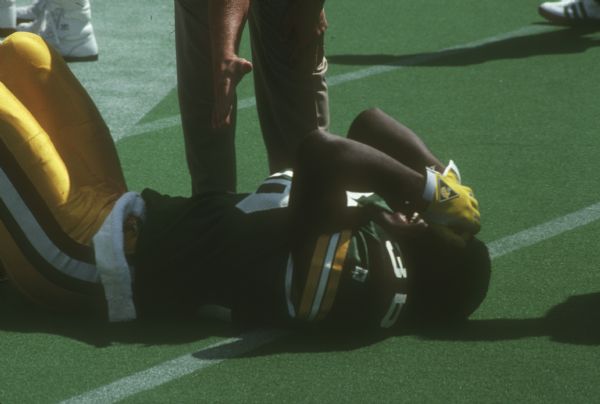 Green Bay Packer Kenneth Davis lying on the field during a preseason game against the Washington Redskins at Camp Randall Stadium in Madison, WI. The Packers lost 0 to 33.