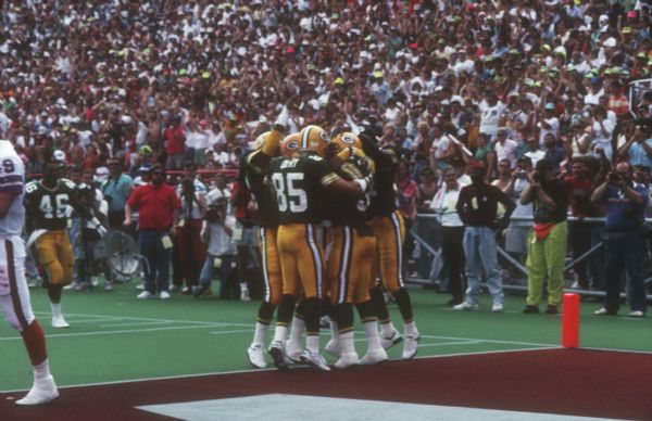 Green Bay Packer Jeff Query (#85) and other players celebrating in the end zone after scoring a touchdown in a preseason game against the Buffalo Bills that took place at Camp Randall Stadium in Madison, WI. The Packers won 35 to 24.