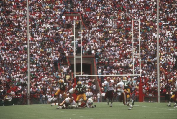 Green Bay Packers in the middle of a play against the Washington Redskins in a preseason game that took place at Camp Randall Stadium in Madison, WI. The Packers lost 0 to 33.