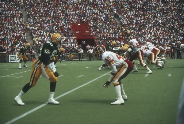 Green Bay Packers wide receiver James Lofton on the line of scrimmage before a play in a preseason game against the Washington Redskins that took place at Camp Randall Stadium. The Packers lost 0 to 33.