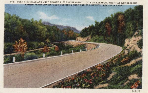 Colorized postcard of a paved road curving to the left through trees, shrubs and bluffs. A dirt road can be seen to the left, and the sky is blue with a few clouds. Text at the top reads: "Over the hills and just beyond lies the beautiful city of Baraboo, and that wonderland known as Wisconsin's summer home for tourists, Devil's Lake State Park."