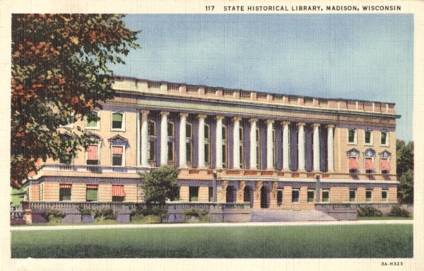 Colorized postcard of an exterior view of the State Historical Library, now the headquarters building of the Wisconsin Historical Society. Awnings are visible on the first and second floor. The text at the top reads "State Historical Society Library, Madison, Wisconsin."