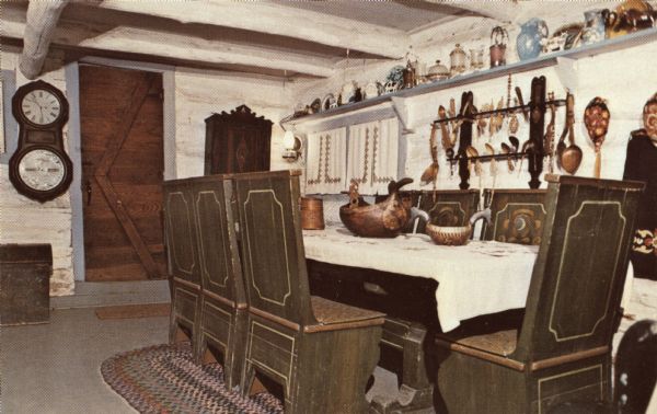 Color postcard of a dining room in a dwelling at Little Norway.