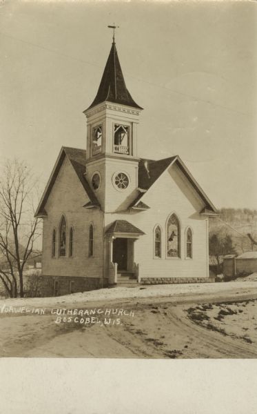 Photographic postcard of the Norwegian Lutheran Church. Below is the handwritten text: "Norwegian Lutheran Church, Boscobel, Wis."