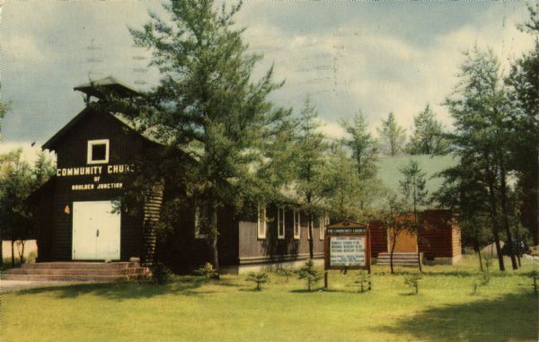 Colorized postcard of the Community Church with many trees surrounding it.