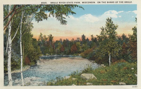 Colorized postcard view of the Brule River flowing through the forest. Some trees show autumn color. Caption reads: "Brule River State Park, Wisconsin. On the Banks of the Brule."