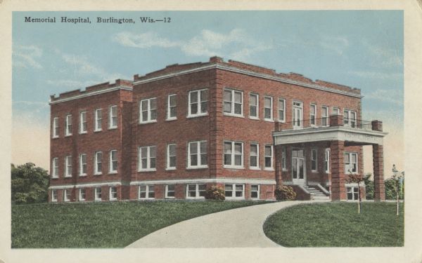 Colorized postcard of the Memorial Hospital. Text at top left reads: "Memorial Hospital, Burlington, Wis."