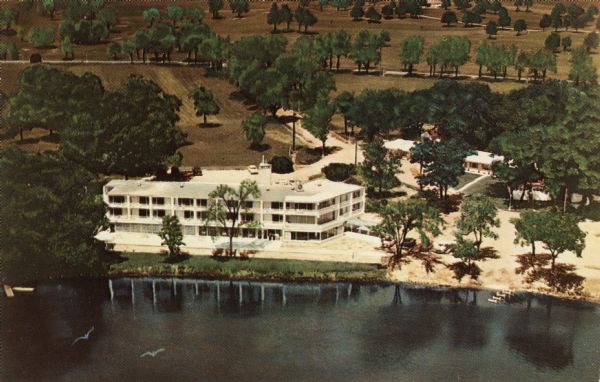 Color postcard of an aerial view of Cerami's Island View Hotel Motel Resort on the shore of Brown's Lake.