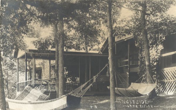 Photographic postcard of the Ingleside Resort on Lake Ripley. There is a porch on the cabin, and several hammocks are strung on trees on the lawn. Caption reads: "Ingleside Resort -- Lake Ripley."