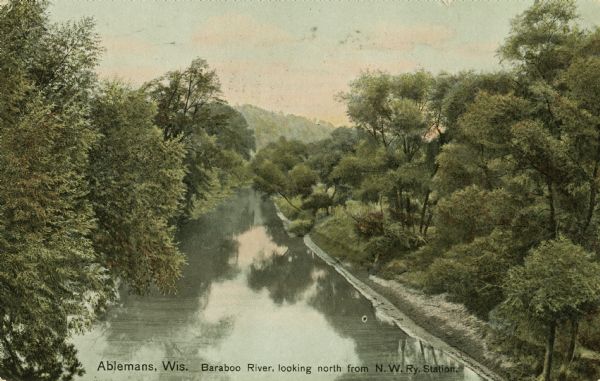 Colorized postcard with view of the river and tree-lined shorelines.