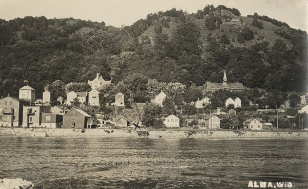 View of Alma from across the Mississippi River. Caption reads: "Alma, Wis."