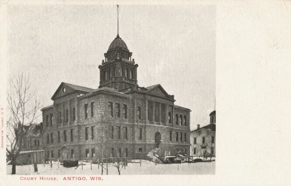 Exterior of Court House in winter. Caption reads: "Court House, Antigo, Wis."