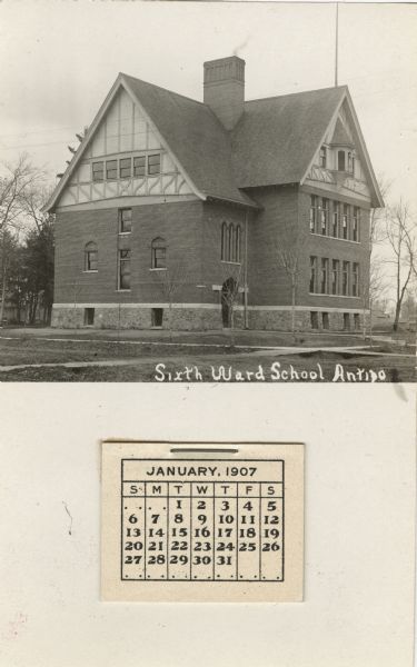 Photographic postcard view of the Sixth Ward School, a three-story brick building surrounded by grounds. There is a calendar attached to the lower portion of the postcard. Caption reads: "Sixth Ward School, Antigo."