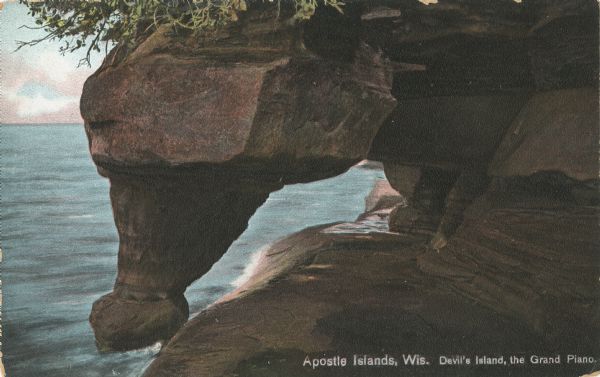 Postcard of the Grand Piano geological formation on Devil's Island. Caption reads: "Apostle Islands, Wis. Devil's Island, the Grand Piano."