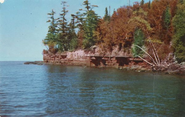 Color postcard of a rocky shoreline on Devil's Island, part of the Apostle Islands of Lake Superior.