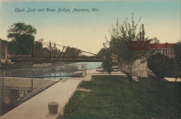 View along the right side of the third lock and draw bridge spanning the Fox River. Caption reads: "Third Lock and Draw Bridge, Appleton, Wis."