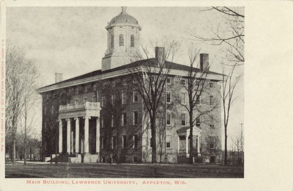 Front entrance and side of Main Building on the Lawrence University campus. Bare trees line the grounds outside the building. Caption reads: "Main Building, Lawrence University, Appleton, Wis."