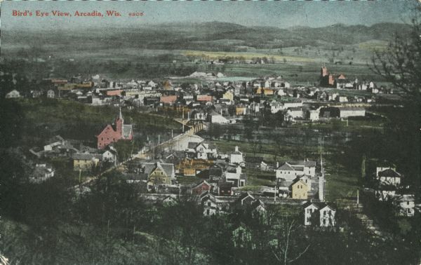 Elevated view of downtown and the Trempealeau River. Caption reads: "Bird's [sic] Eye View, Arcadia, Wis."