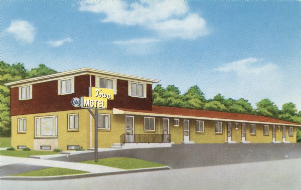 View of the yellow and brown Town Motel and parking lot.