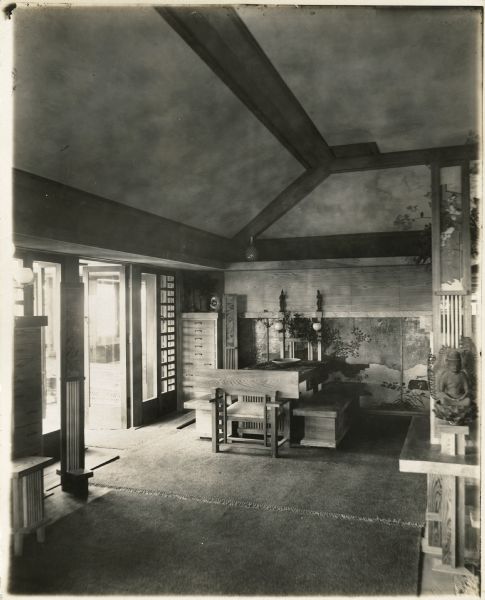 Dining room in Taliesin II. Several pieces of Asian art decorate the space.