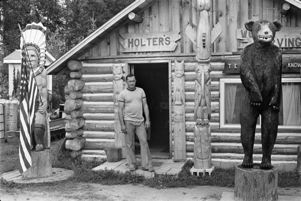 Wood carver Jerry Holter outside his studio in Clam Lake.