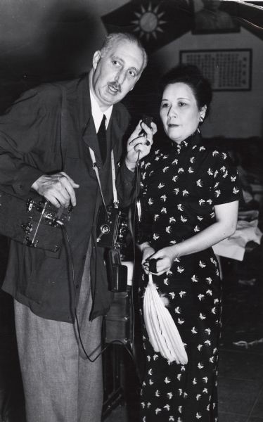 Cecil Brown, a reporter for the Mutual Broadcasting System, recording an interview with Madame Chiang Kai Shek.