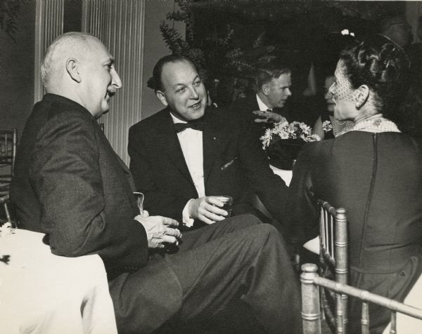 Robert Sarnoff (center), president of NBC, at a social gathering in Tokyo with Cecil Brown, the head of NBC's bureau in Tokyo, and Martha Brown.