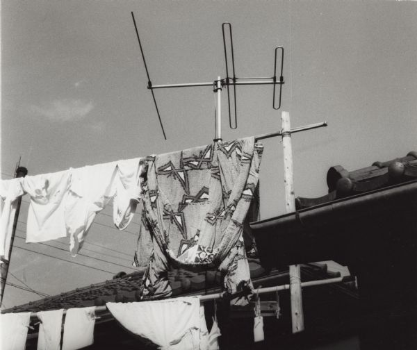 Traditional Japanese clothing hanging up to dry, with a modern television antenna in the background. A view that caught the eye of an NBC journalist and amateur photographer based in Japan.