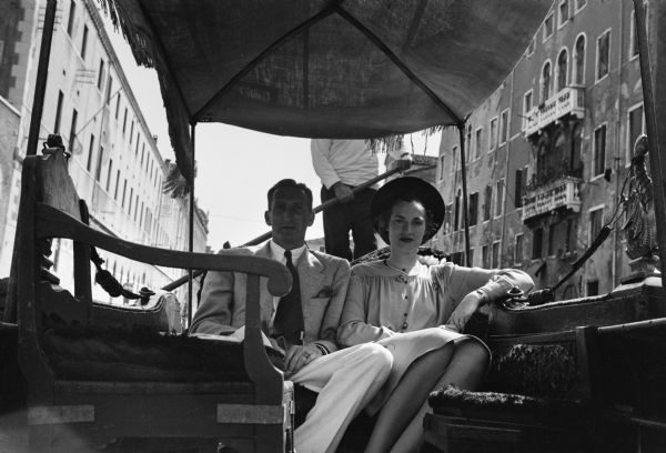 CBS journalist Cecil Brown, who was then reporting from Rome, Italy, is seen here in a Venetian gondola with Martha, his new bride, during their honeymoon.