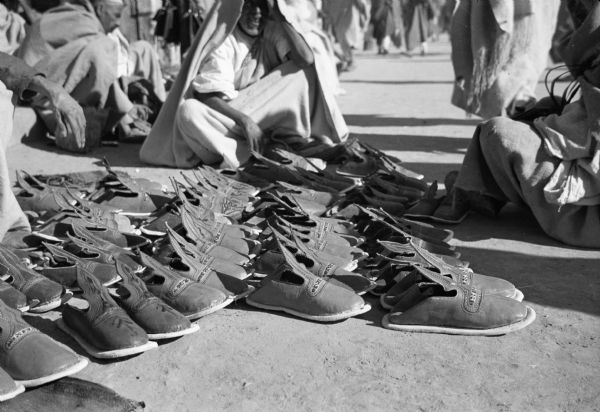 Fascinated by the street life in the market at Misurata, Libya, journalist Cecil brown took this photograph of handmade shoes for sale.
