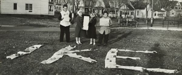 John Lavine (left), Nancy Jane Nelson, Virginia Rafshol, and Gary Berger indicate their support for the presidential candidacy of Dwight D. Eisenhower. As an adult Lavine became a Democrat.