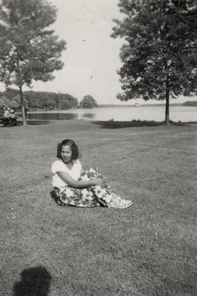 Nedra Arms, seated on the grass at Brittingham Park.
