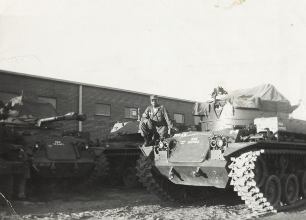 Lewis Arms sits on a military tank at the Park Street United States Army Reserve Center.
