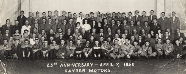 A group portrait of the employees of Kayser Motors, commemorating the 25th anniversary of the company. Seated on the far left is Lewis Arms, who was a mechanic at Kayser Motors at 702 East Washington Avenue.