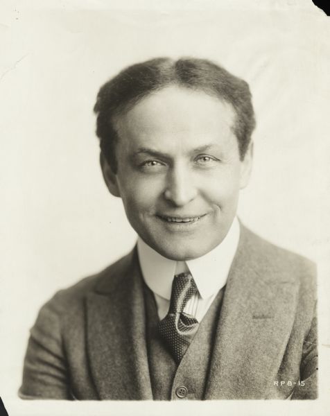 Quarter-length studio portrait of the renowned escape artist Harry Houdini.