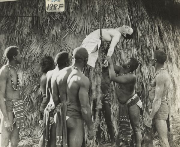 Escape artist Harry Houdini being tortured by cannibals in the silent film "Terror Island." Like the other films in which Houdini stared, the plot was designed to showcase his special talents.